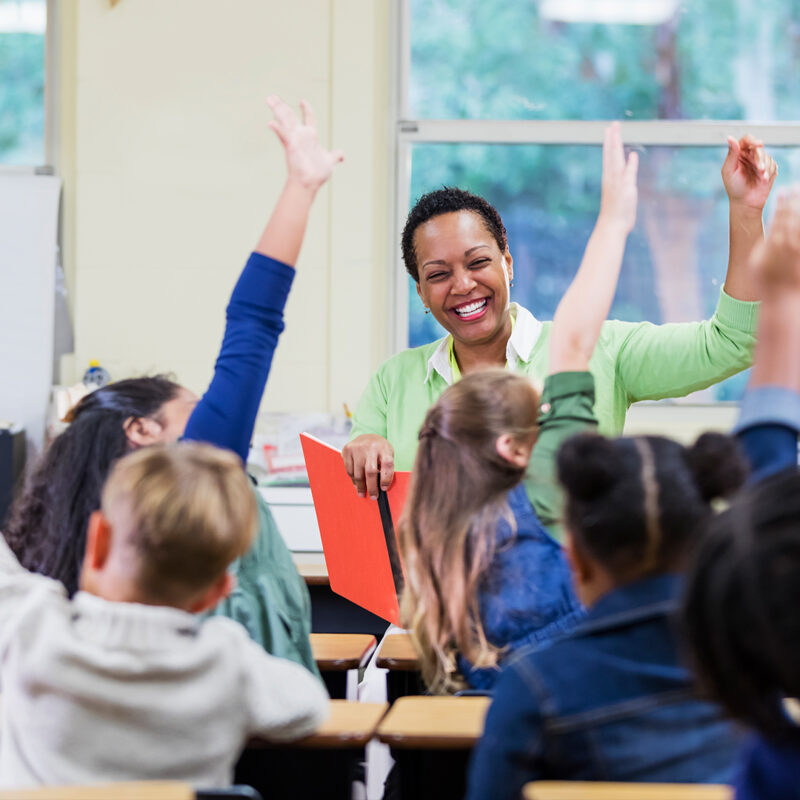 Teacher engaging with children in classroom