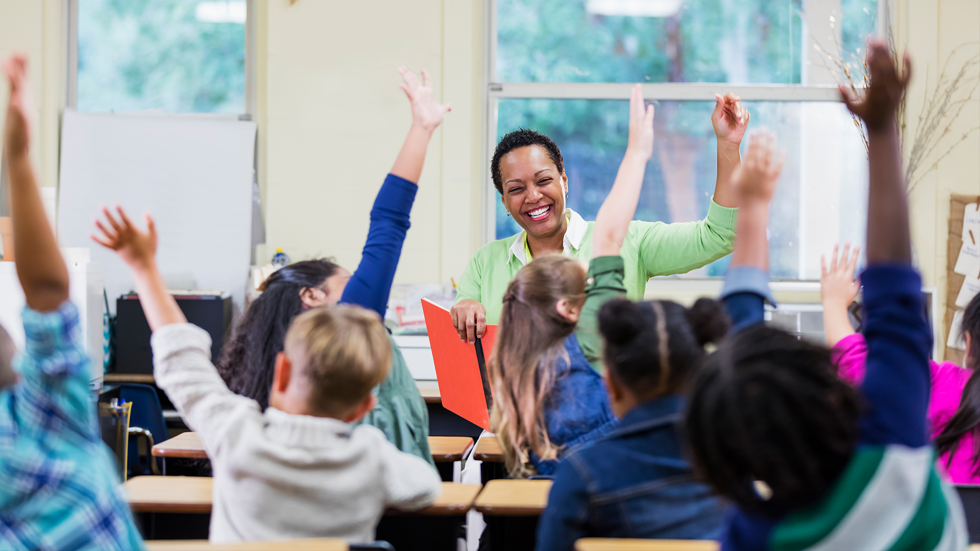 Teacher engaging with children in classroom